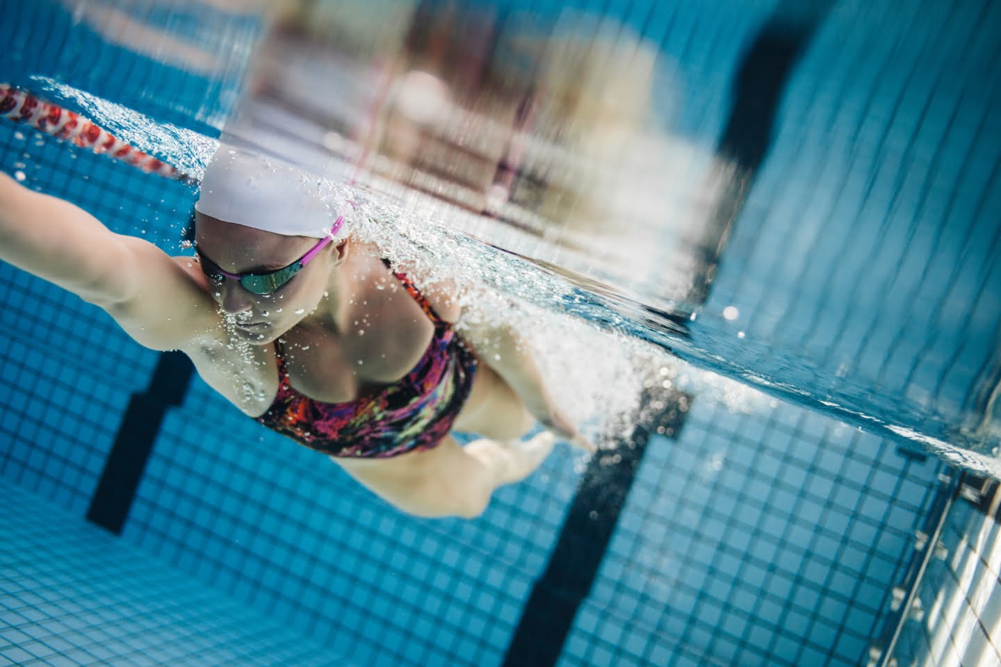 Swimmer training in a pool lane